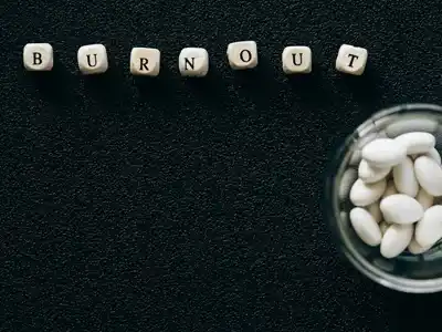 Scrabble tiles that spell out "Burnout"