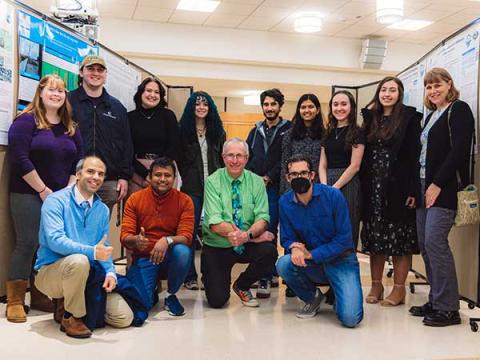 Students and professors smiling