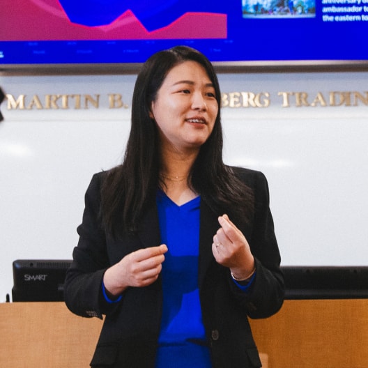 business teacher giving lecture in classroom