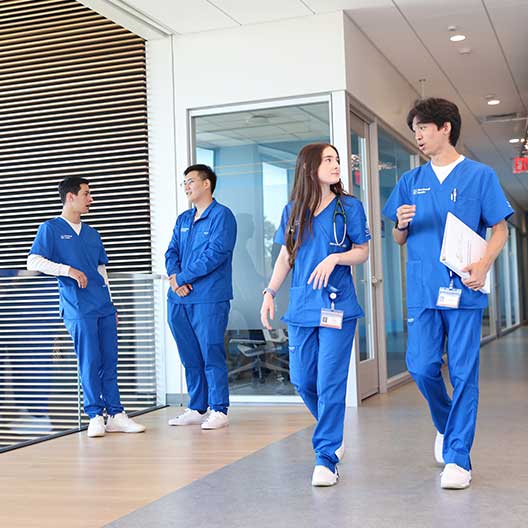 Nursing and PA students walking on campus